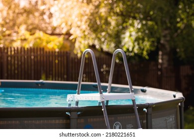 Swimming pool with metal frame for home and garden. Frame swimming pool in the yard. Solar banner.Installation of the pool. The concept of summer holidays and recreation. - Shutterstock ID 2180221651