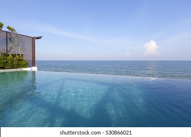 Swimming Pool Near The Beach With Blue Sky At High Class Resort 