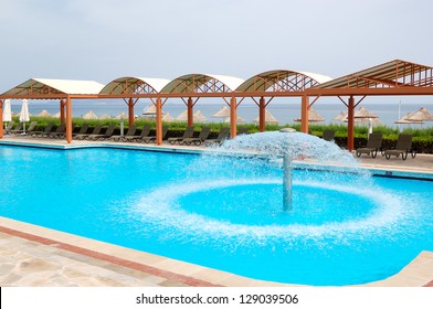 Swimming pool near beach at luxury hotel, Crete, Greece