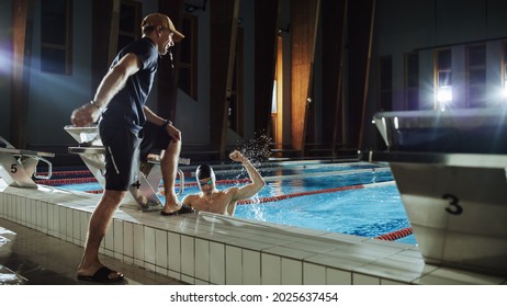 Swimming Pool: Professional Trainer Training Future Champion Swimmer. Experienced Coach Does High-Five with Successful Male Swimmer. Team Ready for World Record and Victory. Cinematic Wide Shot - Powered by Shutterstock