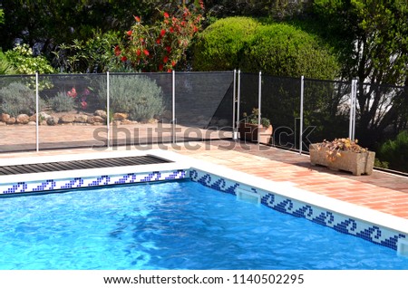 Swimming pool with safety fence