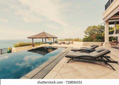 Swimming pool with sea view in luxury villa interior