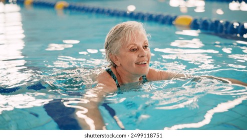 Swimming pool, senior woman and fitness with smile, exercise and recreation with wellness. Mature person, playful and lady with water aerobics, healthy and cardio workout with physical therapy or joy - Powered by Shutterstock