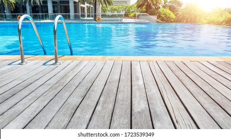 Swimming pool with stair and wooden deck.