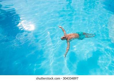 Swimming in a pool top angle - Powered by Shutterstock