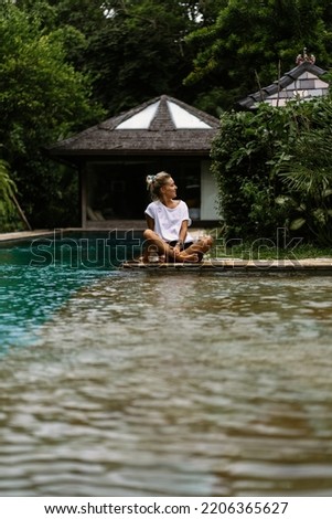 Similar – Rückansicht einer blonden Frau  im Infinity Pool