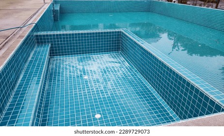 The swimming pool is under tiling maintenance