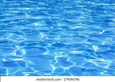 Swimming Pool Water Surface With Sparkling Light Reflections