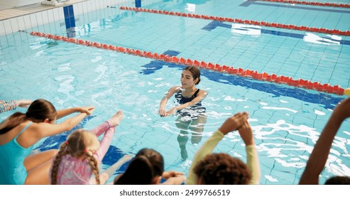 Swimming pool, woman and kids with fitness, water and coach with safety, instructions and teaching. People, trainer and students with recreation, learning and instructor with conversation and expert - Powered by Shutterstock