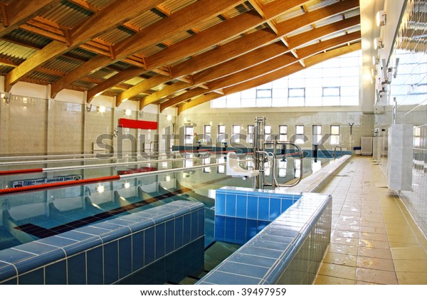Swimming pool\
with wooden roof beams interior\
photo