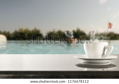 swimming pool and wooden table on a holiday day