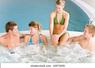 Swimming Pool - Young Happy People Relax In Hot Tub