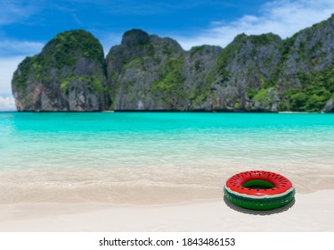 Swimming Ring Bouy On The Beach And Blue Sea Island With Outdoor Sun Lighting.