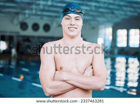 Swimming, sports and portrait of man by pool for training, competition and exercise in gym. Professional, fitness and male swimmer with crossed arms for challenge, workout and practice for wellness