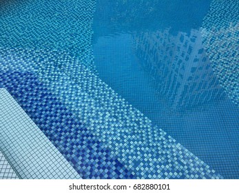 Swimmingly Pool Pool Patterm With Building Reflections On Water Skin