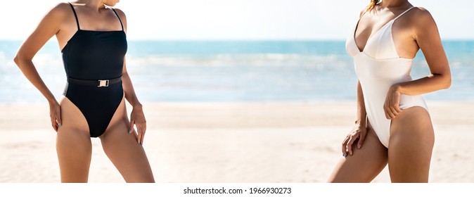 Swimsuit Models At The Beach With Perfect Bikini Body. Summer Swimwear Fashion Banner. Two Fit Young Women. Sun Tan On Skin. Friends On Tropical Vacation. Exotic Ocean And Blue Sky In The Background.