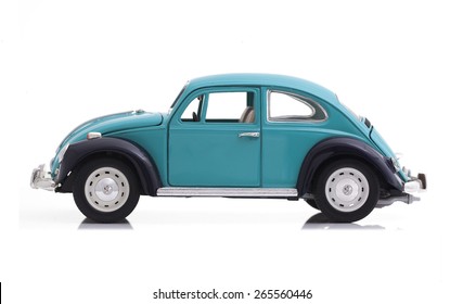 SWINDON, UK - APRIL 1, 2015:  VW Beetle in Blue Die cast model on a white background.