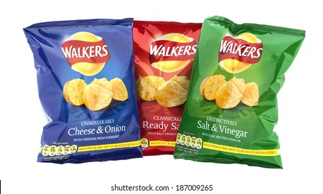 SWINDON, UK - APRIL 13, 2014:  Three Packets Of Walkers Crisps  Isolated On A White Background. Walkers Is A British Snack Food Manufacturer 