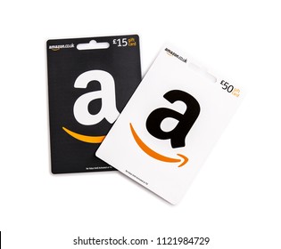 SWINDON, UK - JUNE 27, 2018: Two Amazon Gift Cards on a white background