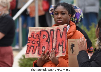 Swindon, UK. June 6 2020. A young black woman at a British Black Lives Matter protest as UK protesters march in solidarity with US demonstrators following the killing of George Floyd in Minneapolis