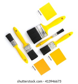 SWINDON, UK - MAY 2, 2016: Collection Of Yellow Paint Brushes With Pantone Colour Samples On A White Background Flatlay