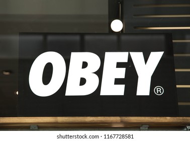 Swindon, Wiltshire, UK Aug 2018. Obey Logo Close Up, Isolated On Dark Background.