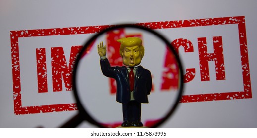 Swindon, Wiltshire, UK, Sept 2018. Trump Bobble Head Figure With A Screw In Hand On White Background With The Word Impeach In Red.