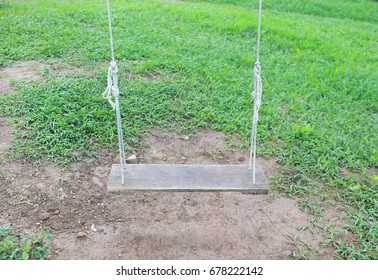 swing hanging in garden - Shutterstock ID 678222142