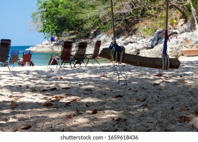 Swing On The Beach By The Sea. Sand, Rope, Log. Rest And Relaxation.