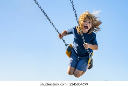 Swinging on playground. Funny kid on swing. Little boy swinging on playground. Happy cute excited child on swing. Cute child swinging on a swing. Crazy playful child swinging very high. - Powered by Shutterstock