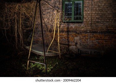 Swings With No People In The Evening At Backyard