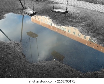 swings are reflected in puddles.the concept of depressive mood