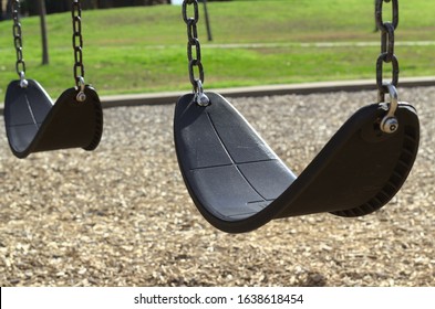 A Swingset In A Sunny Park