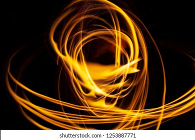 A Swirl Of Golden Embers Captured In A Long Exposure.