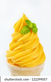 Swirl Of Yellow Soft Serve Ice Cream In A Cone