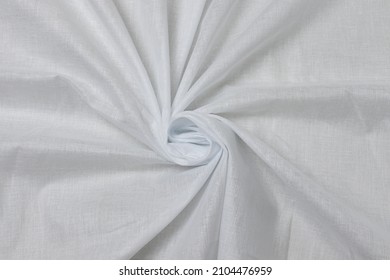 Swirled White-colored Cheese Cloth Fabric Texture Background. This Is Made Of Cotton.