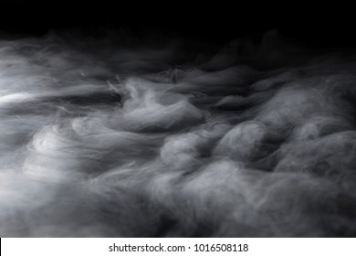 Swirling from bottom left clouds of dry ice fog blowing