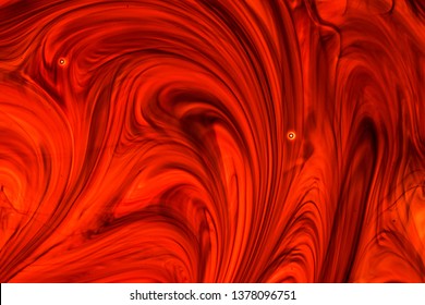 Swirling colorful drops cloud. Color splashes of ink isolated on white and color background. Abstract paint in water. Closeup of the painting. Technicolour Smoke Waves.
