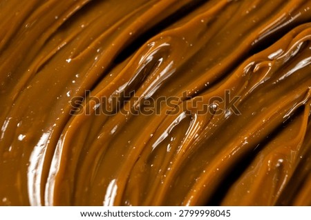 Swirling dulce de leche pattern close up for dessert