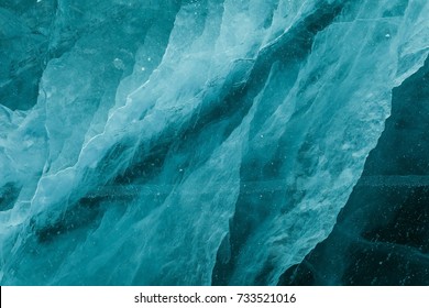 Swirling Ice Texture Under Frozen Surface Of Baikal Lake Near Shaman Rock At Olkhon Island,Siberia,Russia.Using To Show Rapid Transformation Of Water.