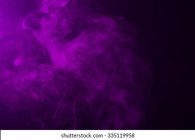 Swirling pink/magenta/purple fog on hazy dark background.  - Shutterstock ID 335119958