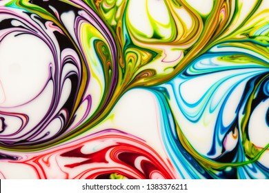 Swirls Of Yellow, Purple, Blue And Red Blend Into One Another Making A Colorful Melting Pot