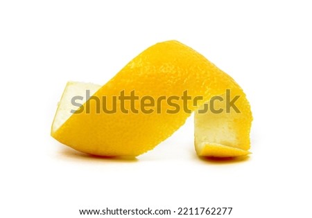 Swirly lemon peel curl isolated on white background