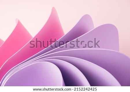 Swirly motion abstract elements with pink and periwinkle sheets. Abstract colorful background