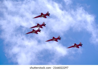 Swiss Air Force display team Patrouille Suisse exercising for start of bicycle stage race Tour de Suisse at village Forch on a sunny summer noon. Photo taken June 10th, 2022, Zurich, Switzerland.