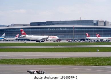 Swiss airplane Airbus A340, registration HB-JMA, taxiing to runway at Zurich airport. Photo taken April 30th, 2021, Zurich, Switzerland.