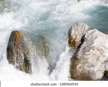 Swiss Alps. Mountain water stream and stones. - Shutterstock ID 1585965919