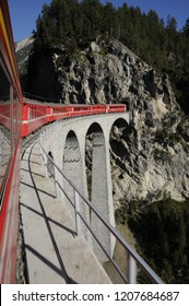 Swiss alps: The Unesco World Heritage train is driving over the "Landwasser-Viadukt"