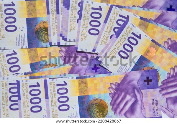 Swiss\
currency. 1000 swiss francs banknotes\
background
