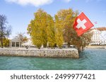 Swiss flag and Lake Geneva view in Geneva, Switzerland